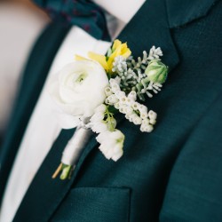 Ranunculus and pieris boutonniere