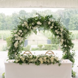 Circle arbor repurposed behind the sweetheart table